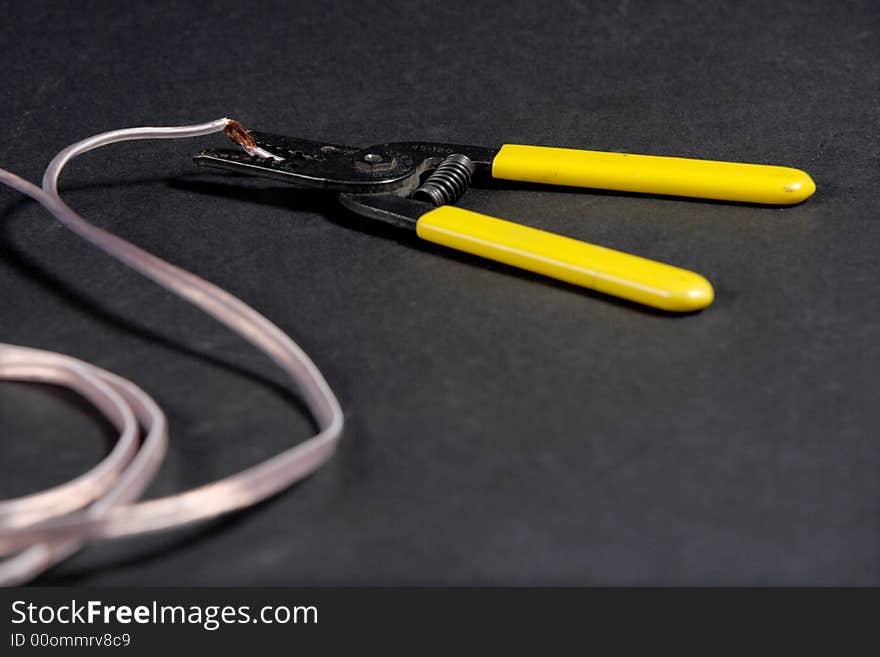 Wire strippers stripping some copper wire