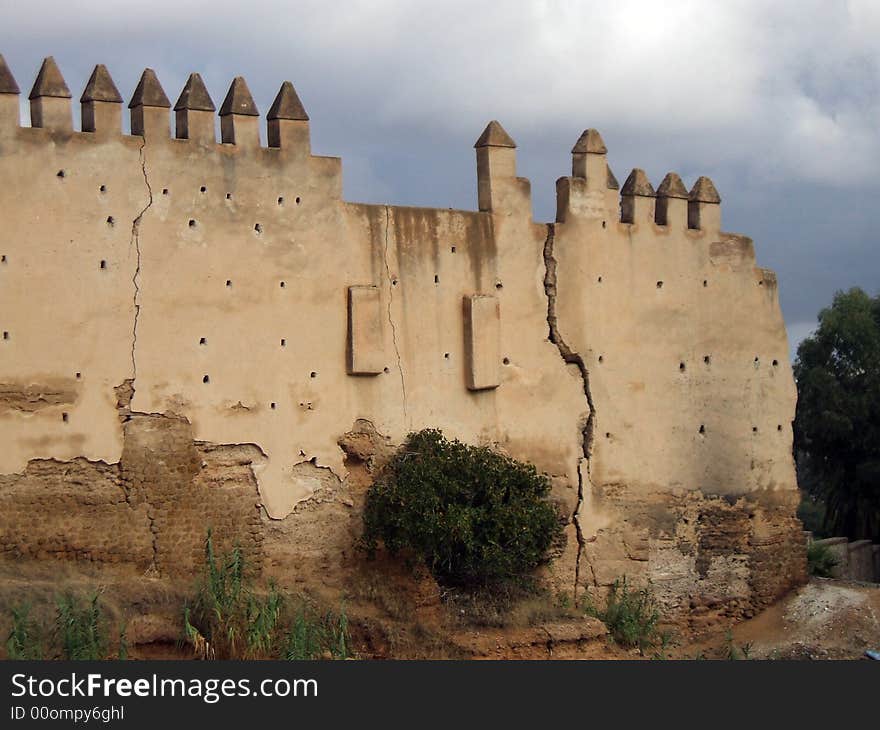 An old crack stone castle wall. An old crack stone castle wall.