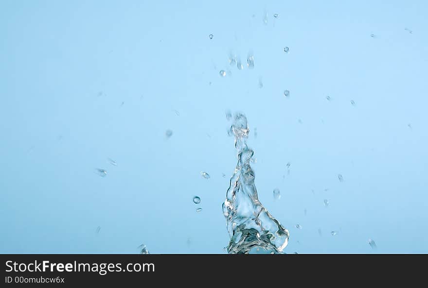 Water splash on light blue background