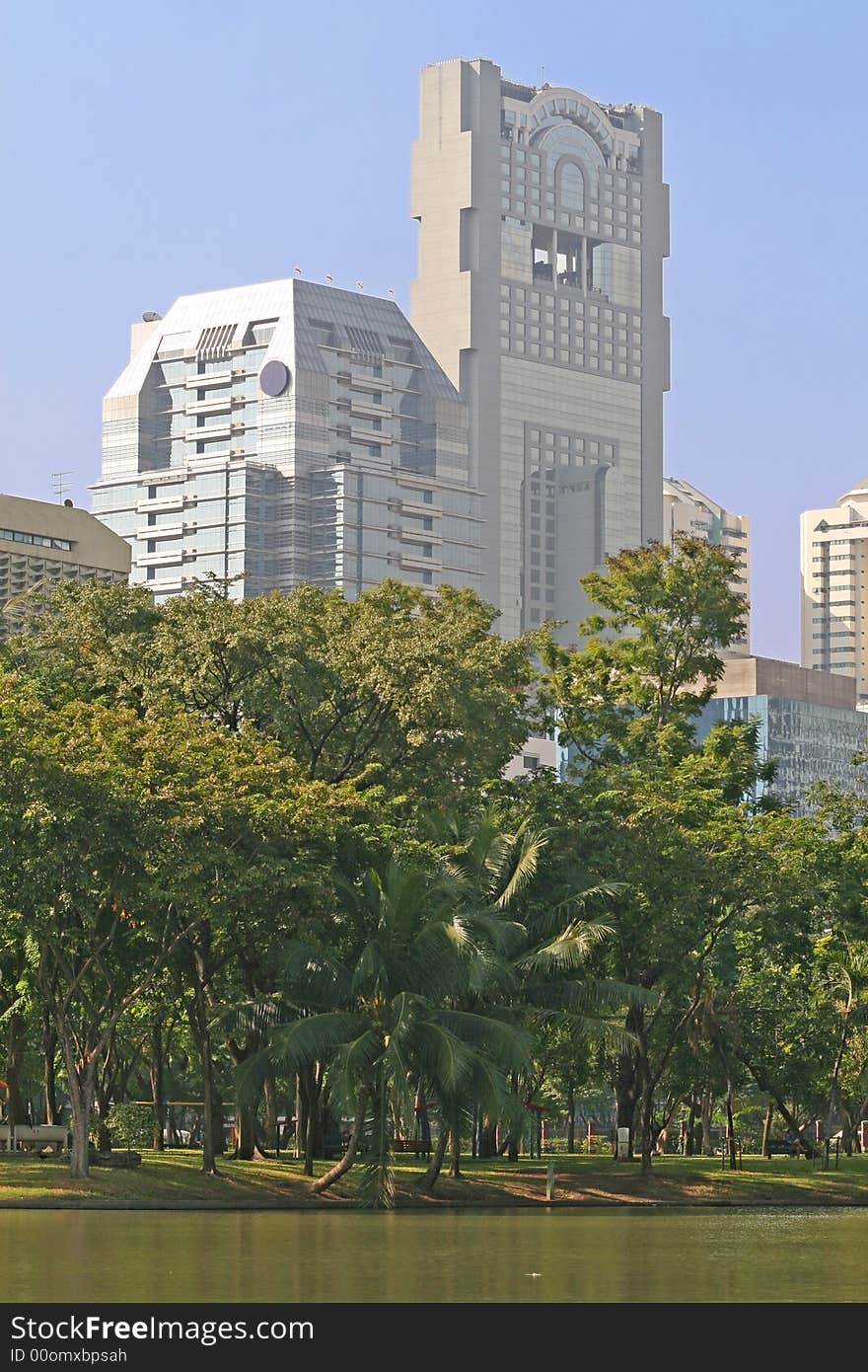 Modern office blocks with a lush tropical park in the foreground. Modern office blocks with a lush tropical park in the foreground