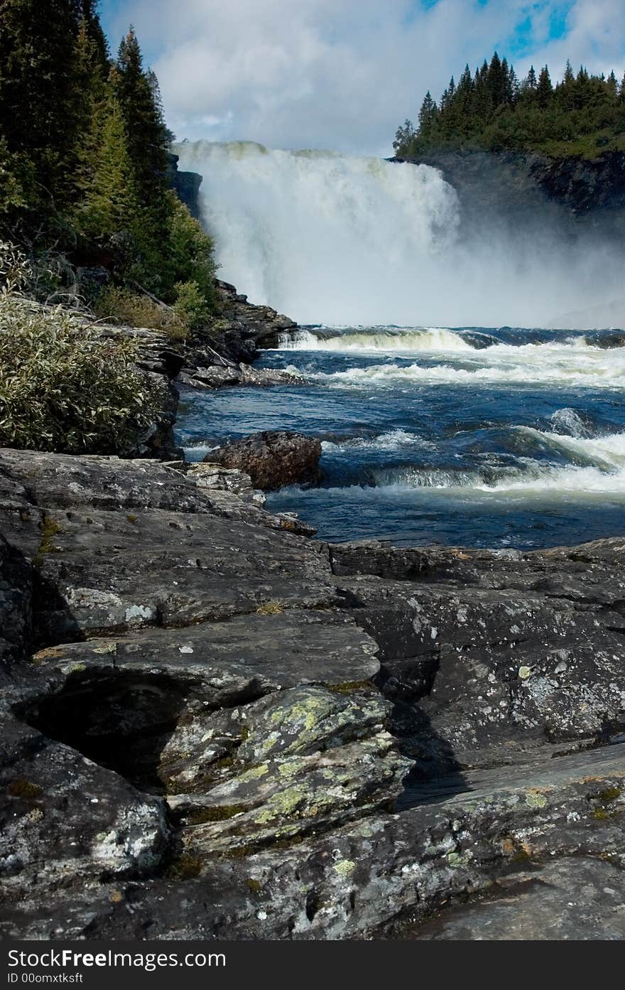 Under Tannforsen waterfall