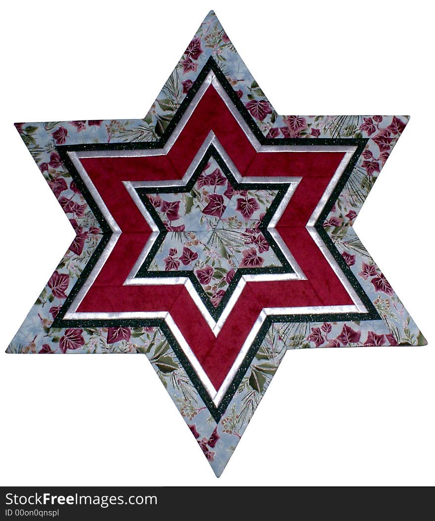 Patchwork Star made of cloth with Christmas patterns. Patchwork Star made of cloth with Christmas patterns.