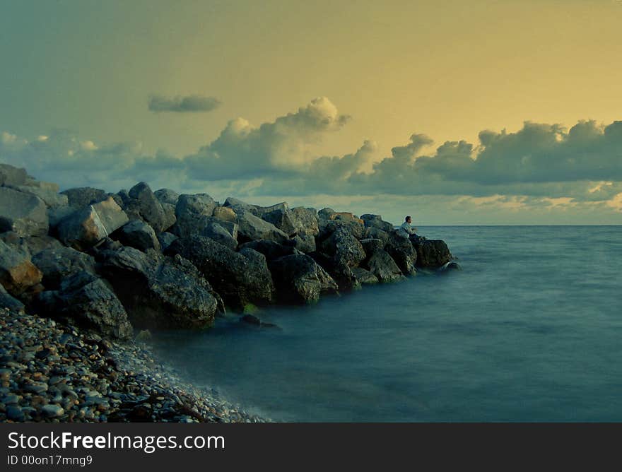 The sky the sea and clouds the person on fishing. The sky the sea and clouds the person on fishing