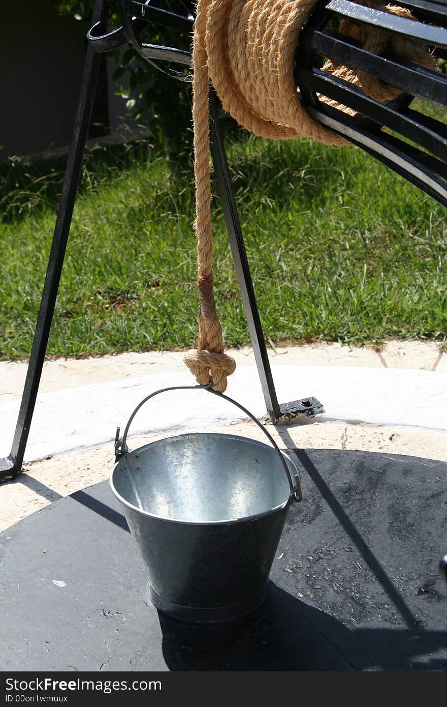 A bucket on a water well