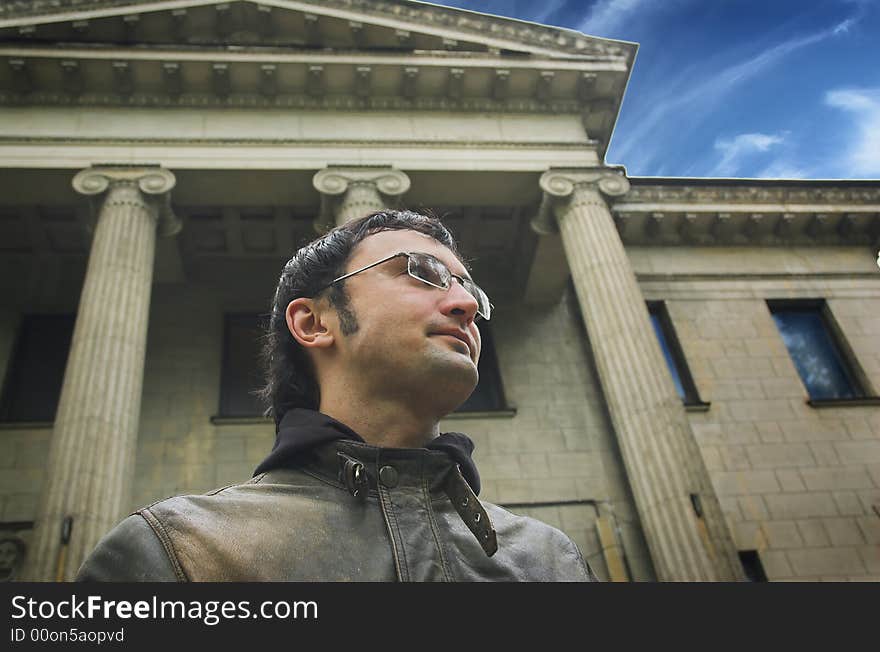 Portrait of the man on a background of a building