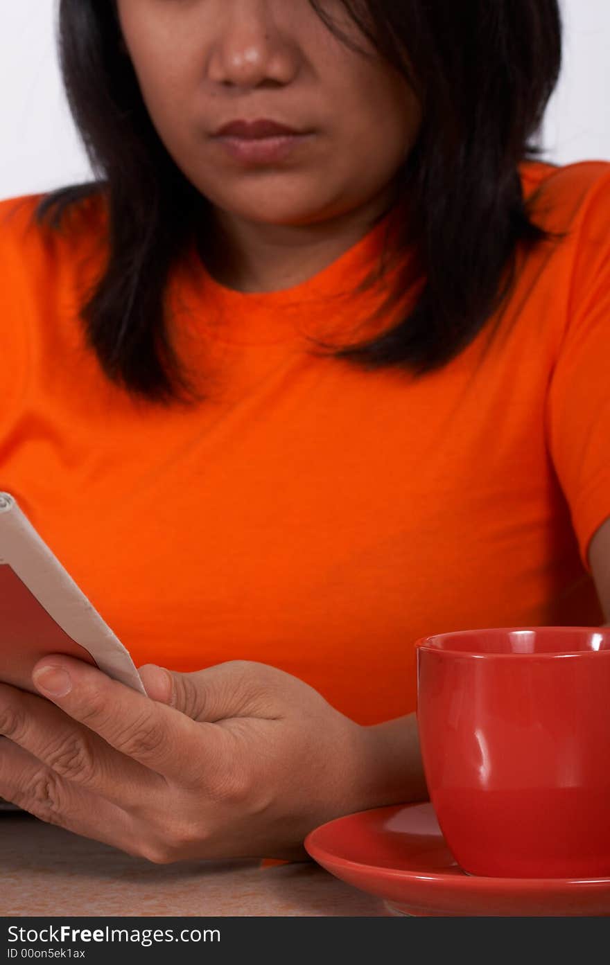 Woman holding books with coffee near her. Woman holding books with coffee near her