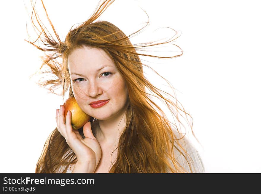 The beautiful girl with an apple on a white background