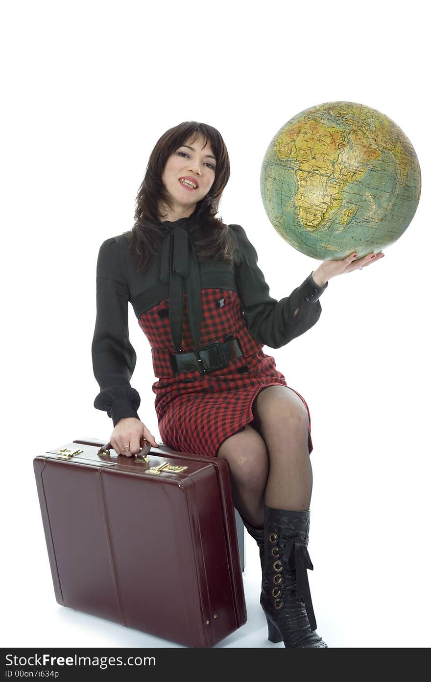 Beautiful brunette with valise and globe on isolated background