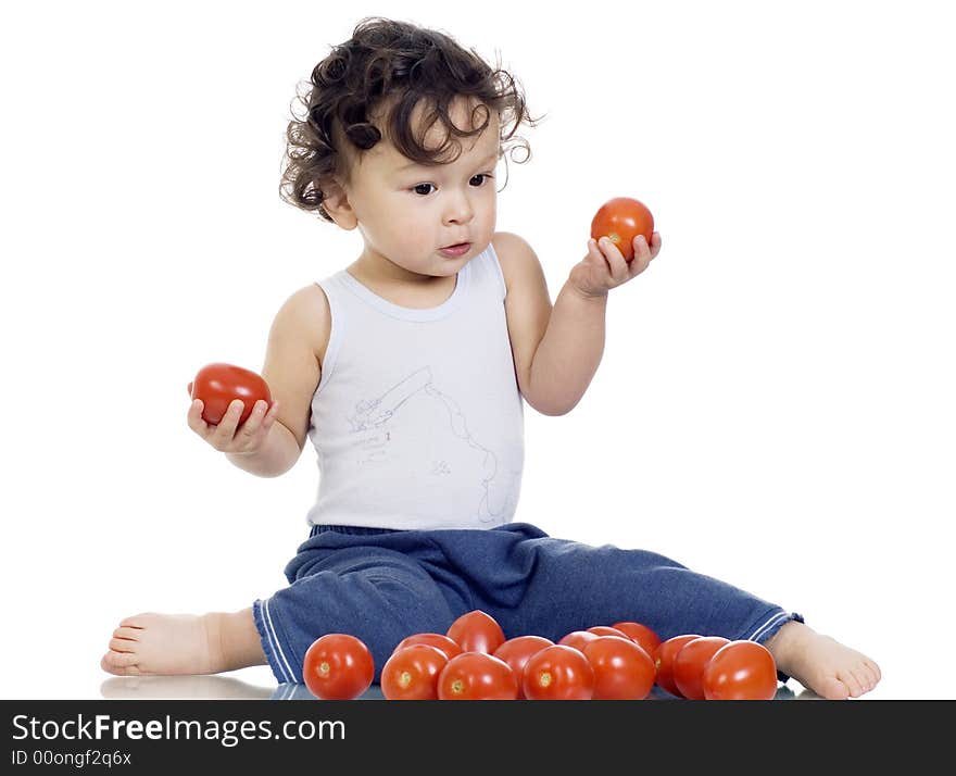 Child with tomato,isolated on a white background. Child with tomato,isolated on a white background.