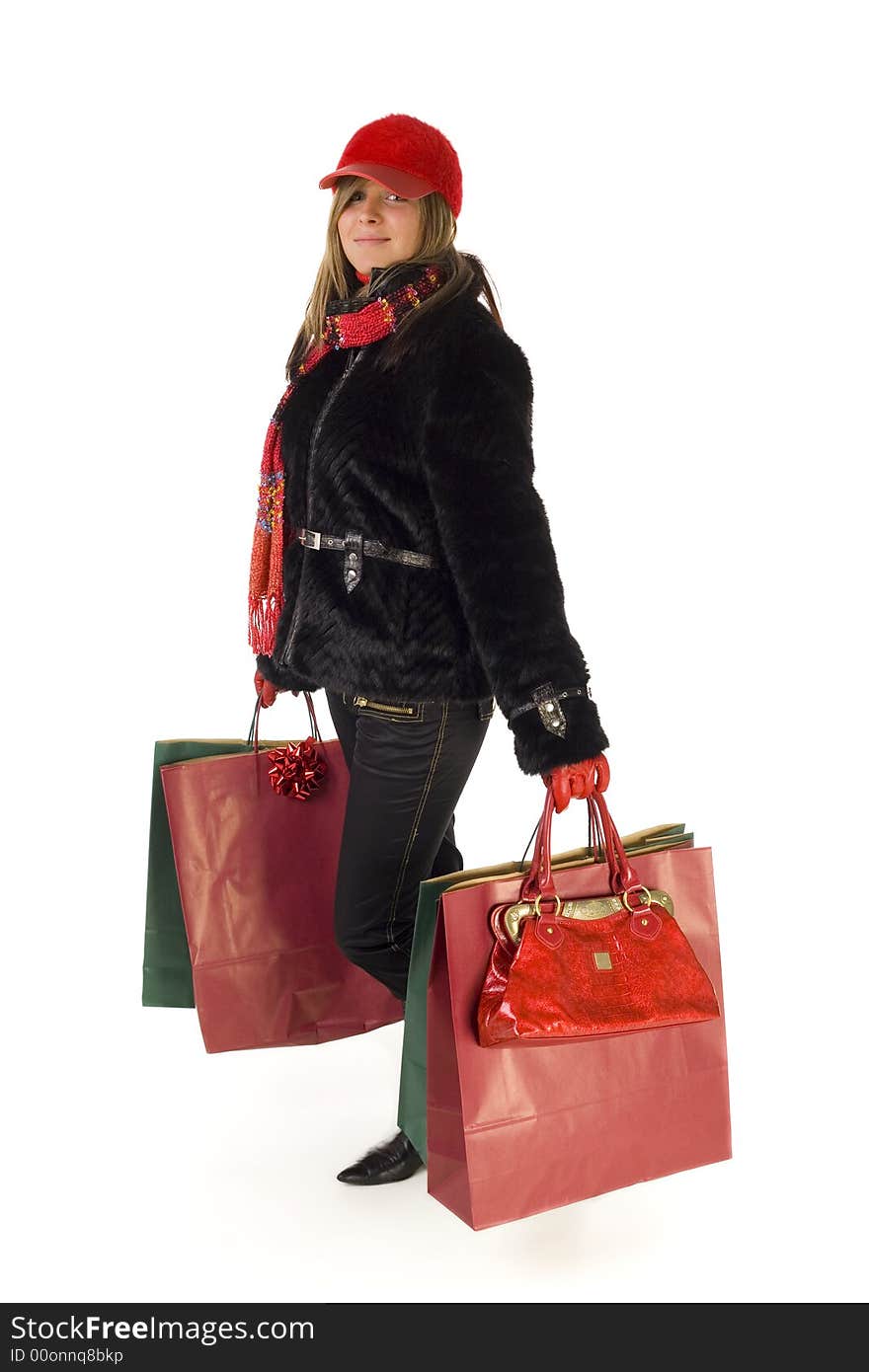 Young woman with shopping bags. Smiling and looking at camera. Isolated on white background. Young woman with shopping bags. Smiling and looking at camera. Isolated on white background.