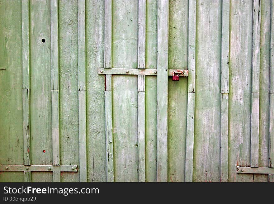 Padlock with old wooden background