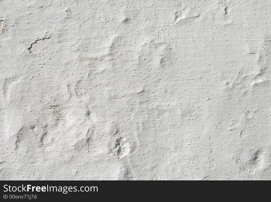 Detail of a rugged white wall suitable as background