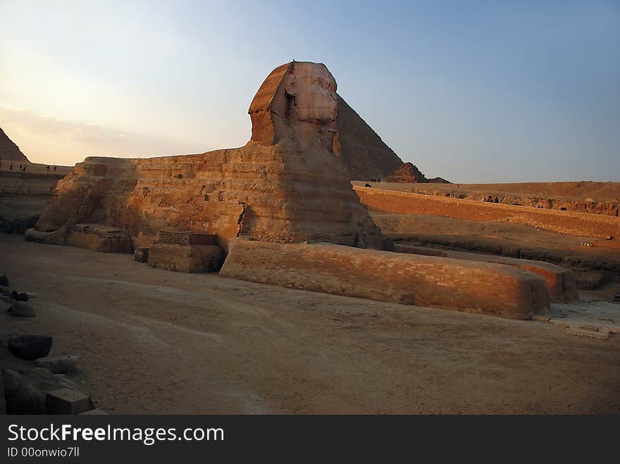 Sphinx on background of the egyptian pyramid