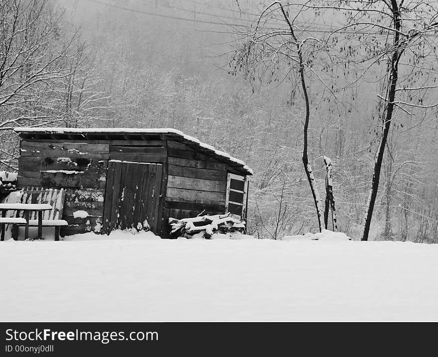 Old wooden hut and snow in the nature ambient. Old wooden hut and snow in the nature ambient