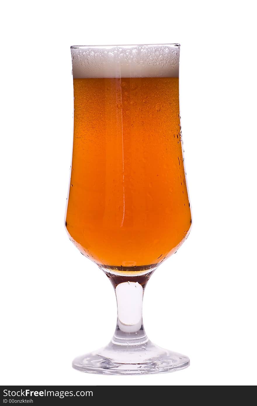 Glass of beer with foam isoleted over white background