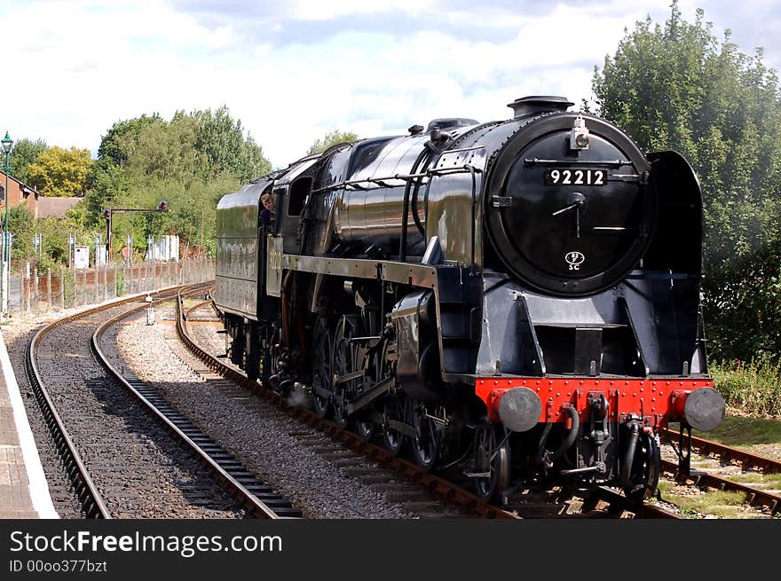 Steam locomotive pulling into the station