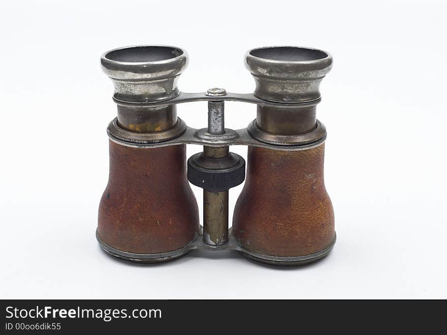 Old pair of binoculars isolated on white background. Old pair of binoculars isolated on white background