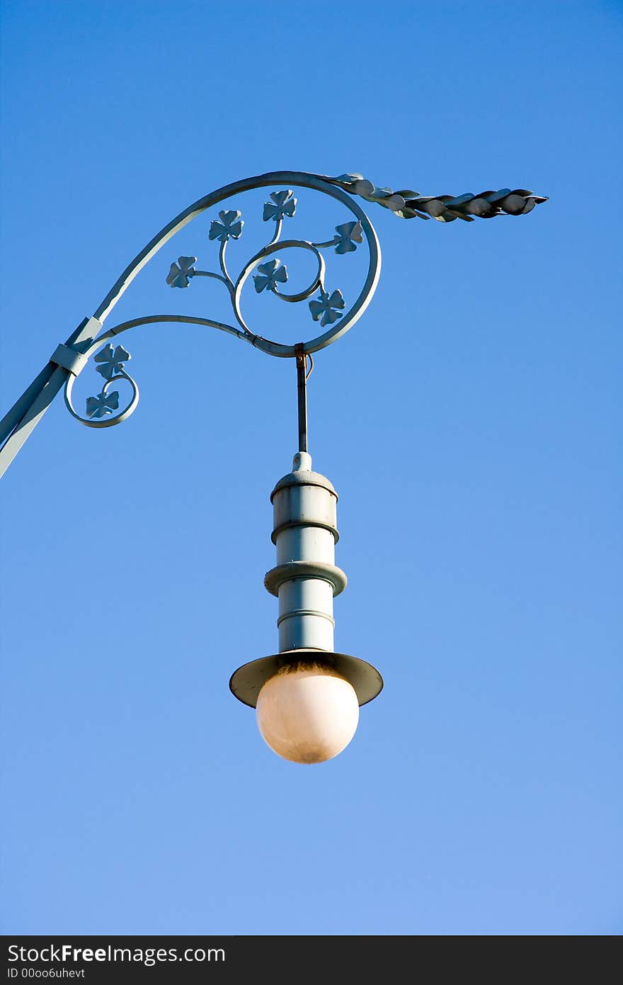 Artistic an old street light, blue sky background. Artistic an old street light, blue sky background