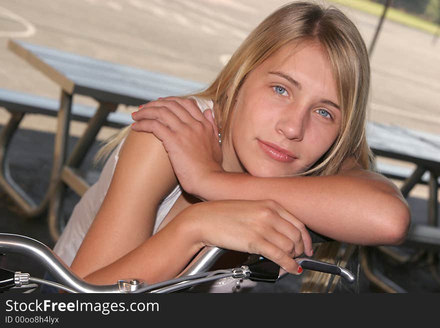 Young Girl Resting On Bike