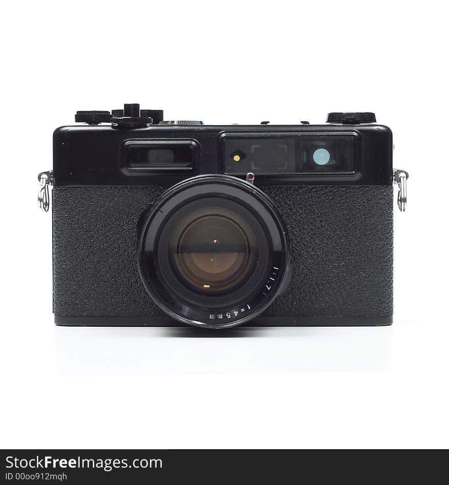 Front elevation view of old, seventies-style rangefinder camera isolated on white background. Front elevation view of old, seventies-style rangefinder camera isolated on white background