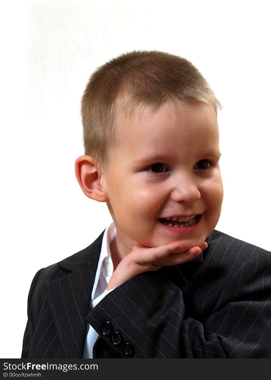 Smiling tot in gray coat and white shirt