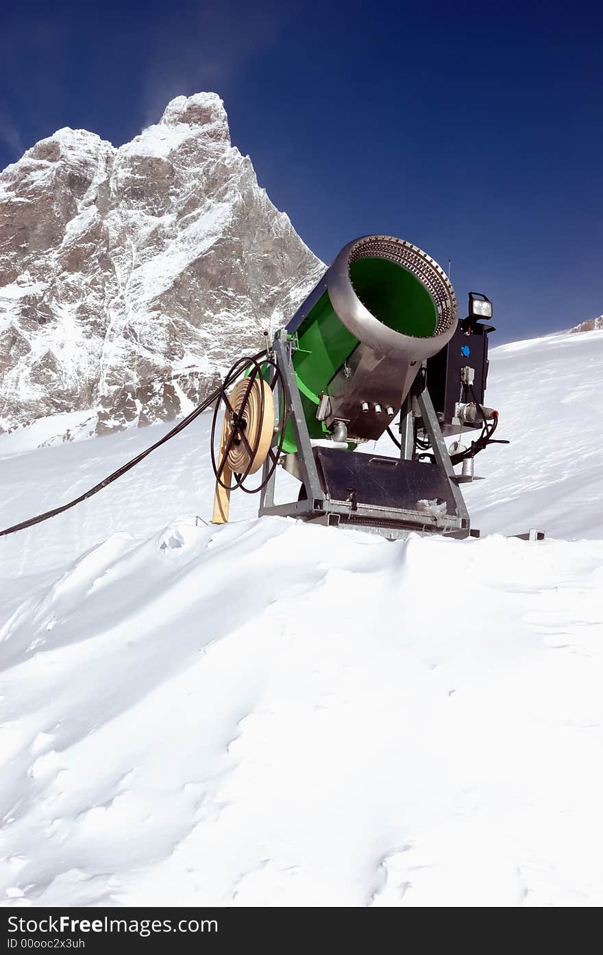 Snow-gun on a ski slope , matterhorn mountain ski resort