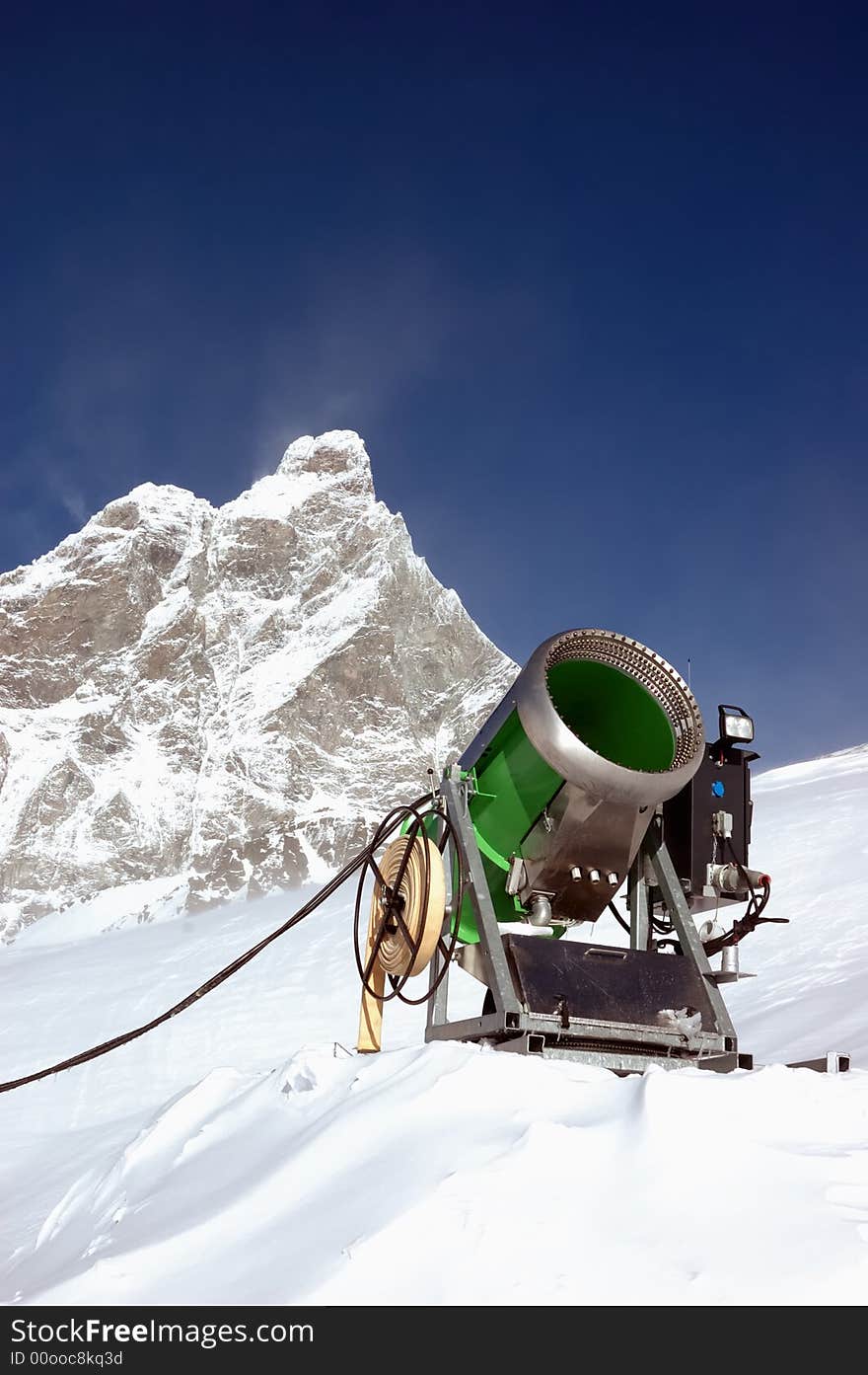 Snow-gun on a ski slope , matterhorn mountain ski resort