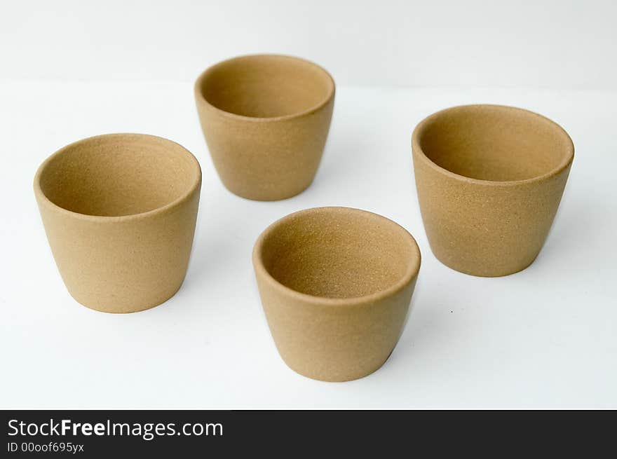 Four isolated Yellow clay Chinese teacup on white background. Four isolated Yellow clay Chinese teacup on white background