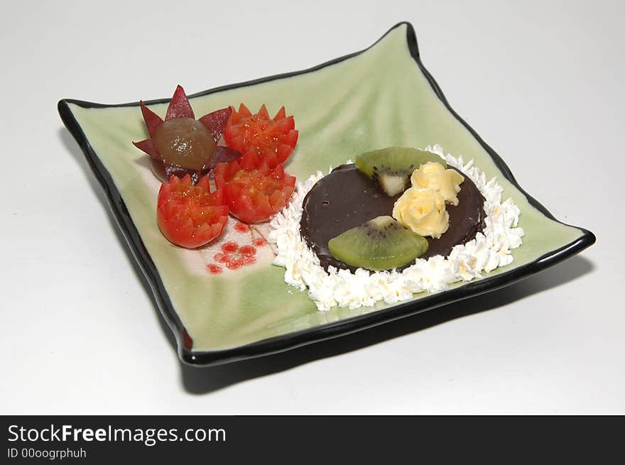 Appetizing fruit dish and cake. Appetizing fruit dish and cake