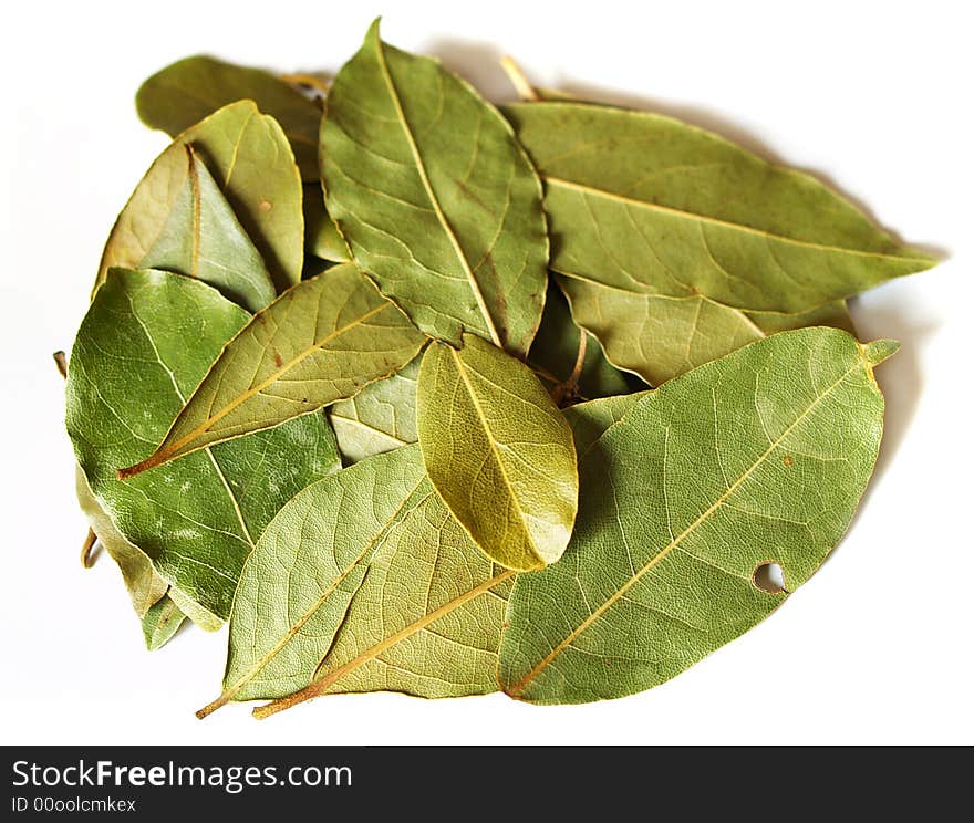 Some bay leaves on a white