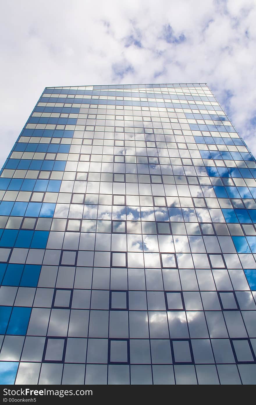 Modern tall building and clouds over it. Modern tall building and clouds over it