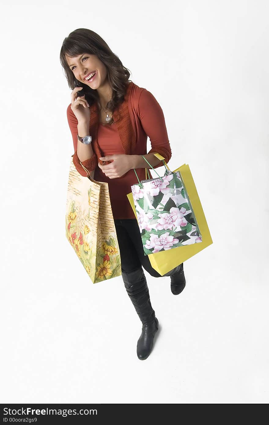 Woman With Shopping Bags And Cellular Phone