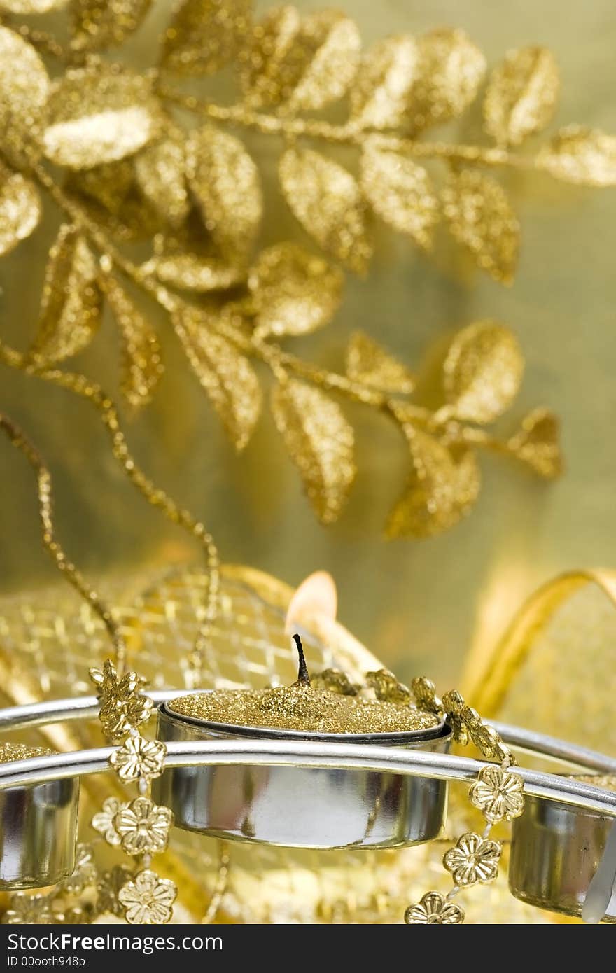 Candle with golden leaves