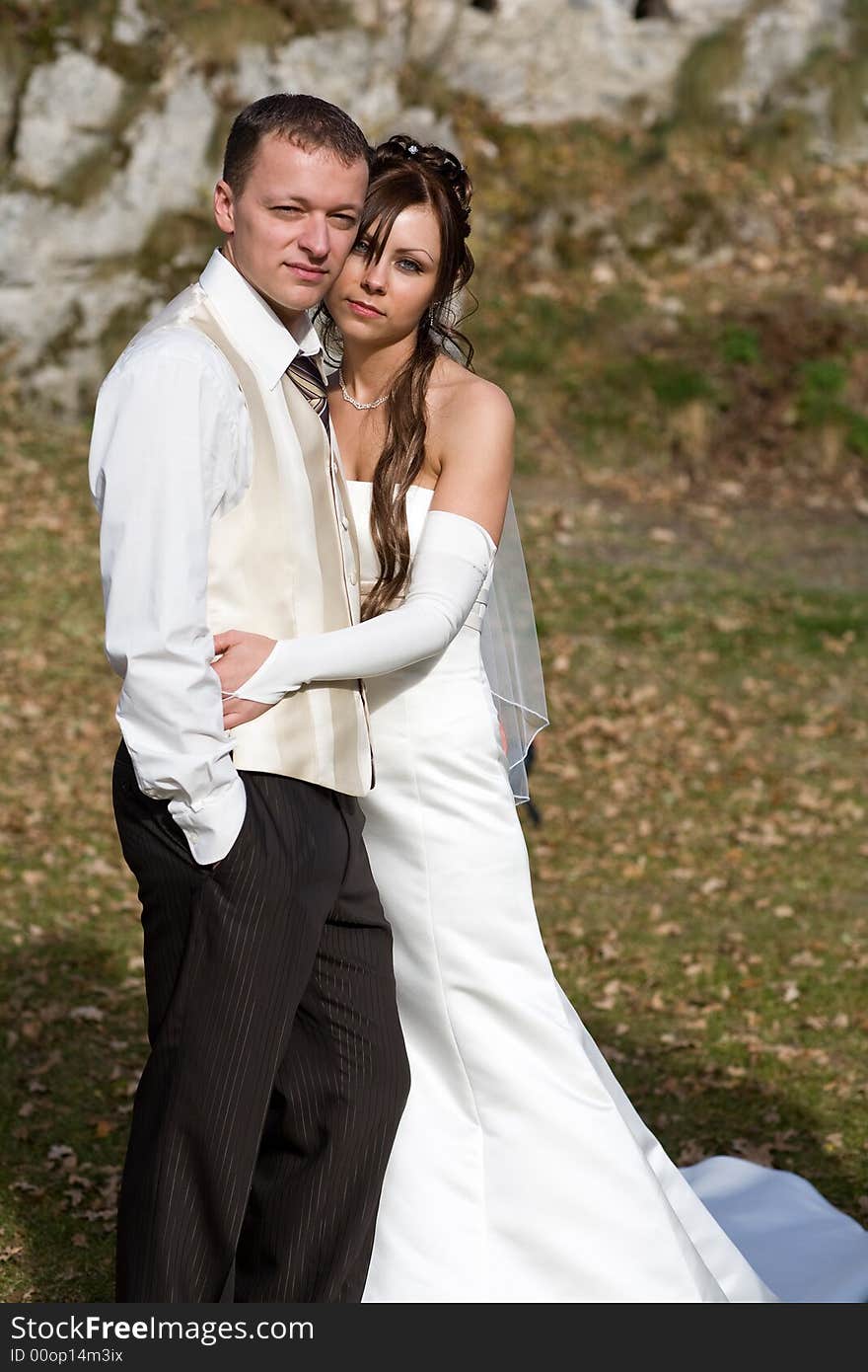 Portrait of an attractive bridal couple outdoors. Portrait of an attractive bridal couple outdoors.