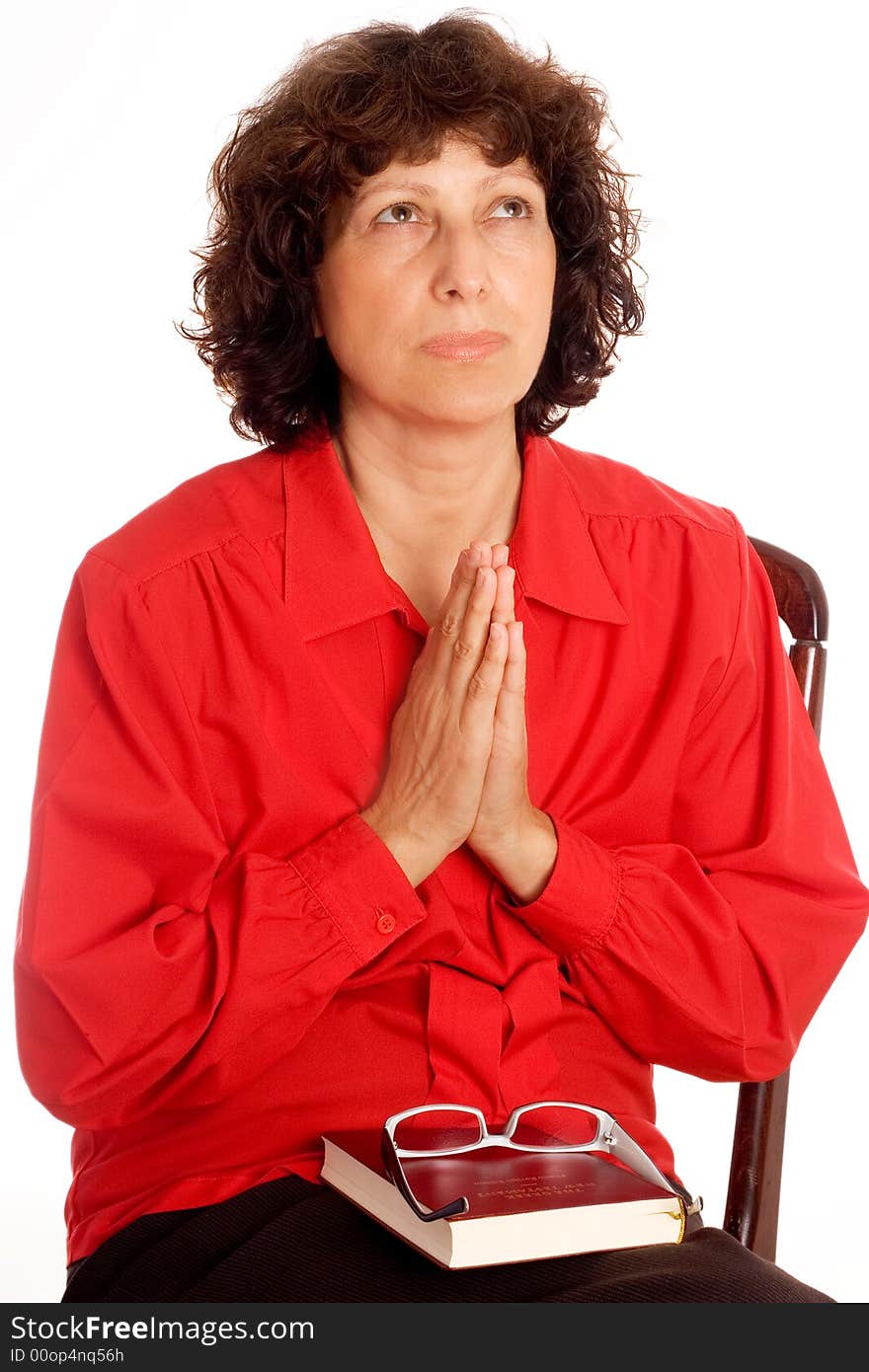 Woman looking up and praying isolated on white