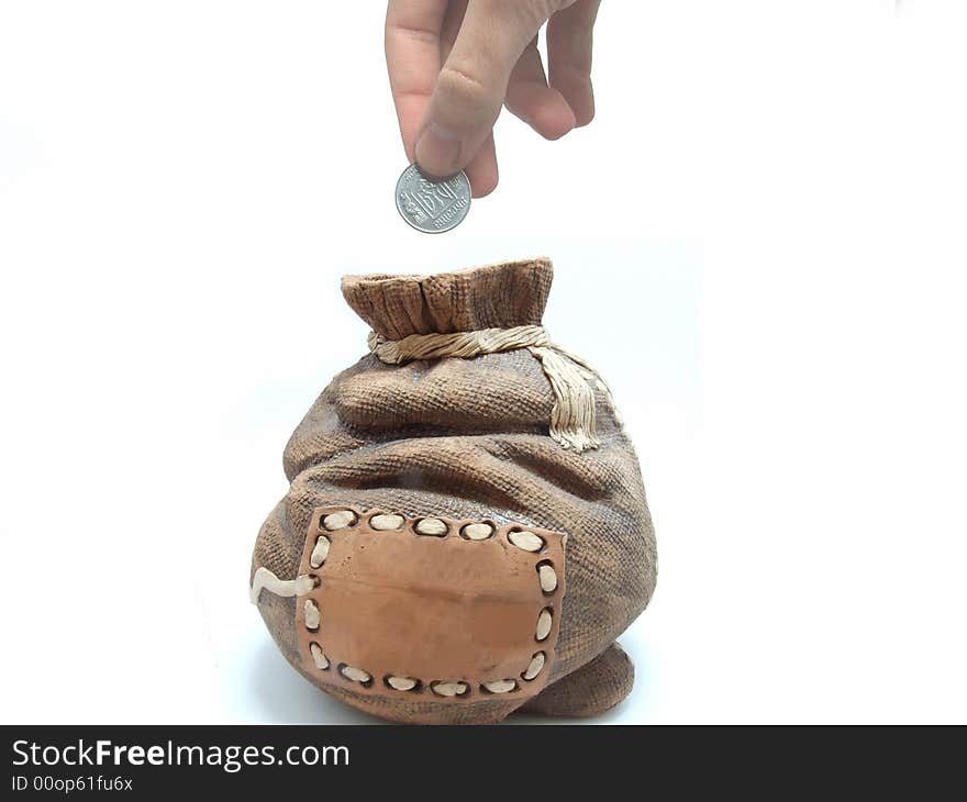 Man inserting one coin in the money bag