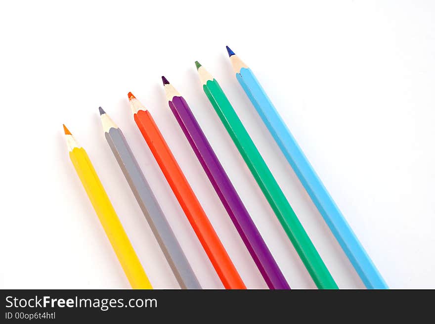 Colorful pencils on white background