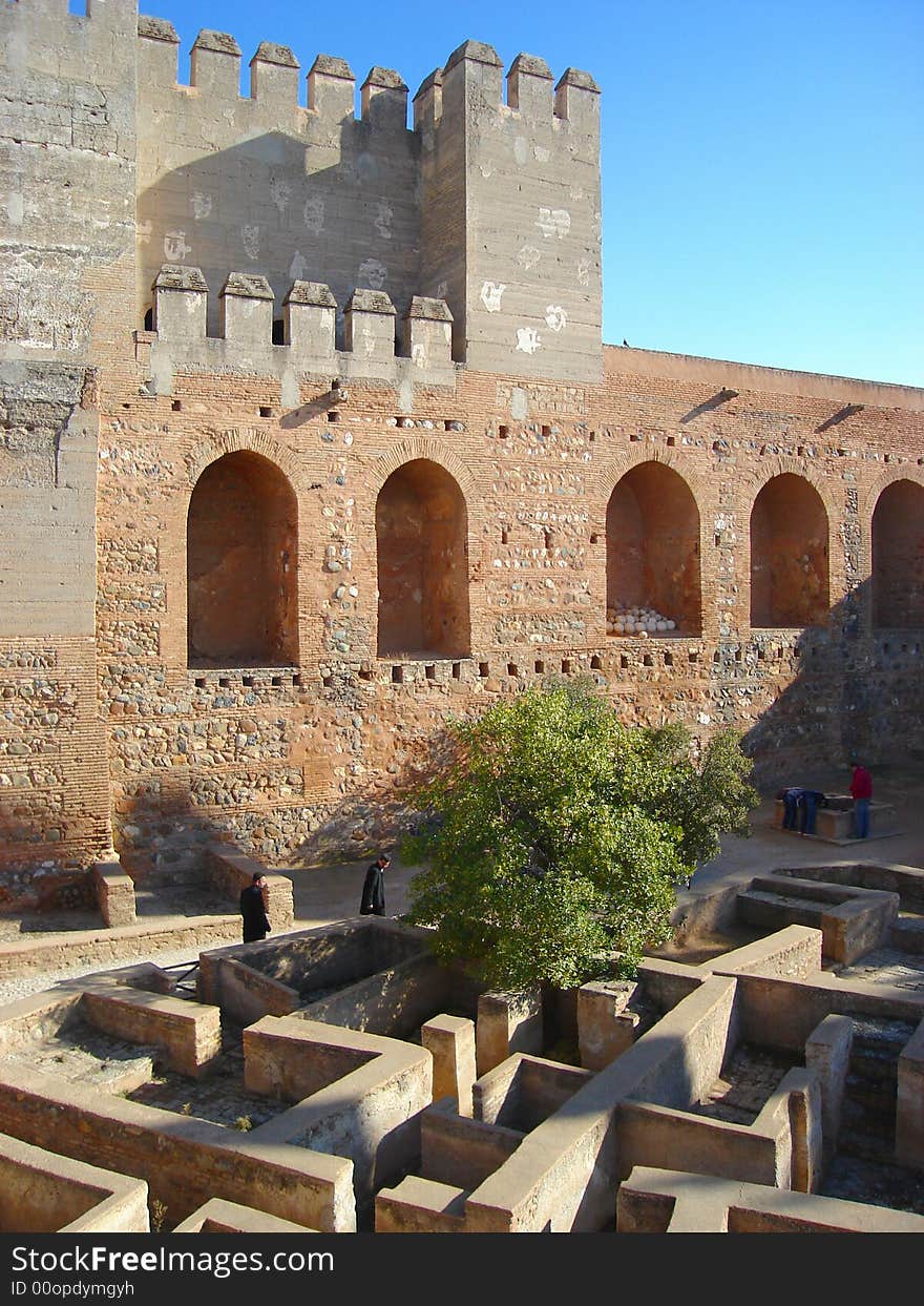 A view showing the fortress and canon courtyard of the well known Alhambra palace, Granada, Andalucia, Spain. A view showing the fortress and canon courtyard of the well known Alhambra palace, Granada, Andalucia, Spain