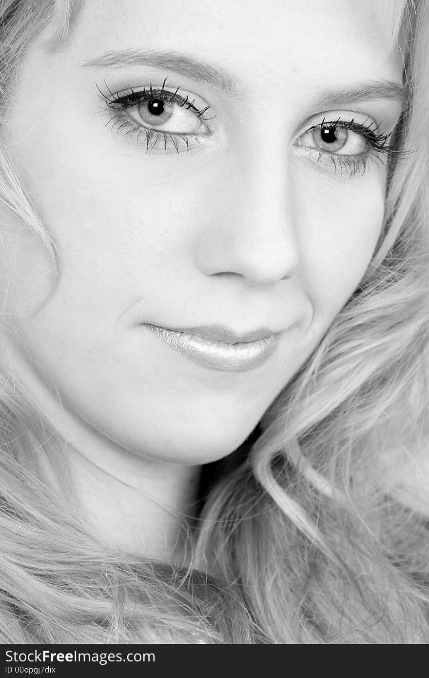 Studio portrait of a long blond girl looking mesmerised. Studio portrait of a long blond girl looking mesmerised