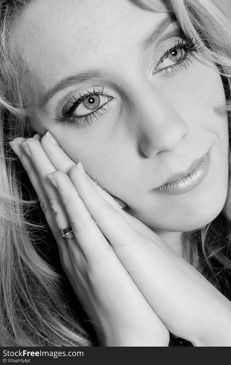 Studio portrait of a long blond girl in rest