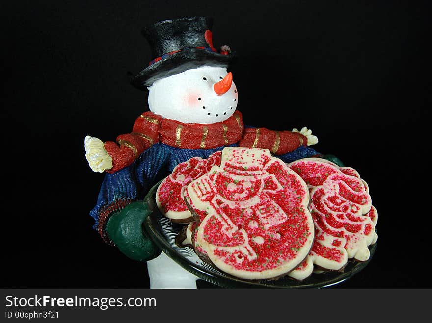 Isolated snowman delivering a plate of cookies. Isolated snowman delivering a plate of cookies.