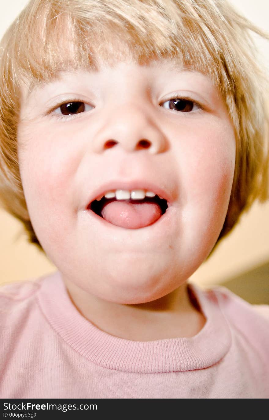 Three year old girl making faces. Three year old girl making faces