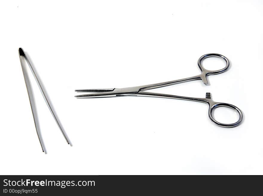 An instrument, as pincers or tongs, for seizing and holding objects, as in surgical operations. An instrument, as pincers or tongs, for seizing and holding objects, as in surgical operations.