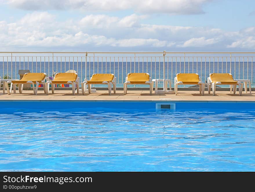 Pool sunbeds around a pool