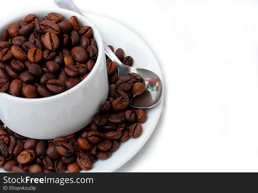 Coffee Beans In Coffee Cup