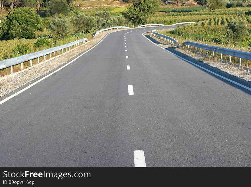 Straight small countryside asphalt road. Straight small countryside asphalt road