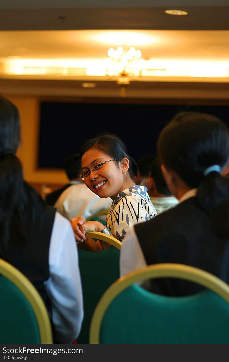 Woman in banquet room smiling