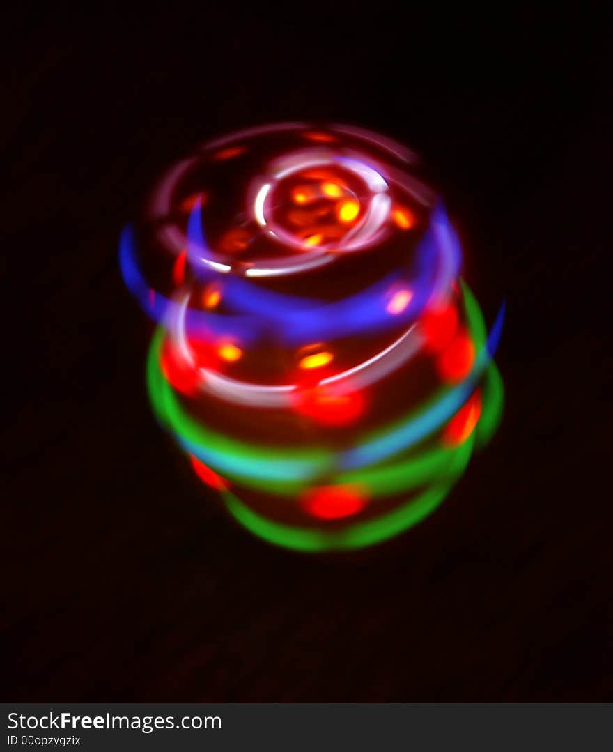 Amazing colorful light come from a rotary peg-top. Amazing colorful light come from a rotary peg-top