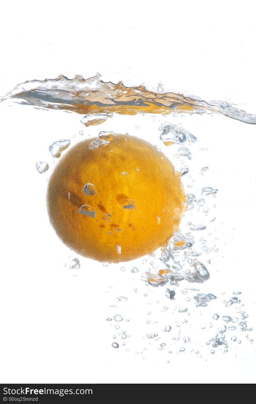 An image of orange falling in water