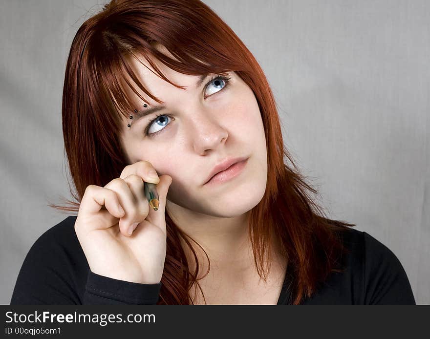 Cute redhead girl with piercings looking up and thinking about a dilemma.

Studio shot. Cute redhead girl with piercings looking up and thinking about a dilemma.

Studio shot.